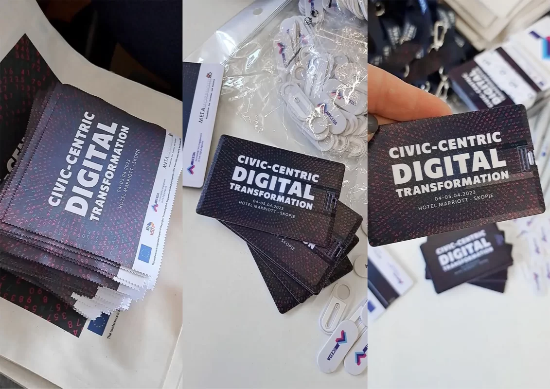 Stacks of brochures and event passes for "Civic-Centric Digital Transformation" conference in Skopje.