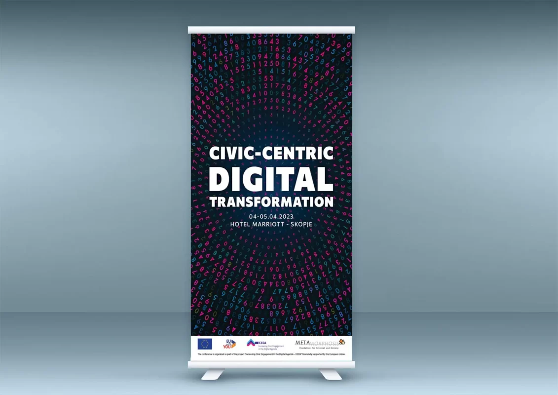 A roll-up banner advertises a "Civic-Centric Digital Transformation" event with dates and a hotel location.