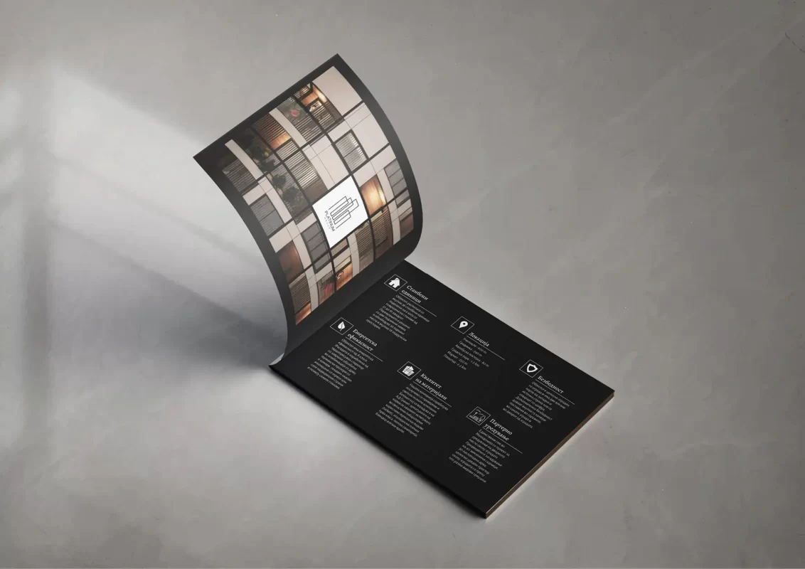 An open brochure with images on a gray background.