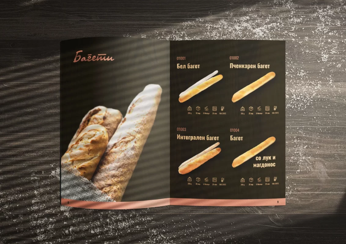 Catalogue with bread images on a wooden table with sunlight and shadows.