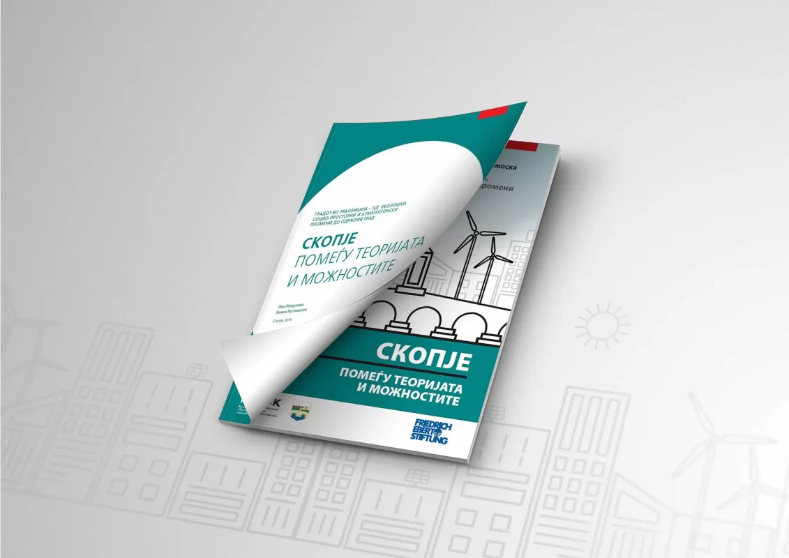 Brochure with the title "SKOPJE" on urban development themes, partially rolled up on a designed background.