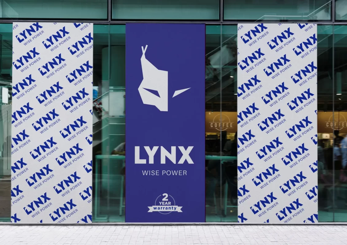 Storefront with "LYNX WISE POWER" branding and 2-year warranty sign on window display.