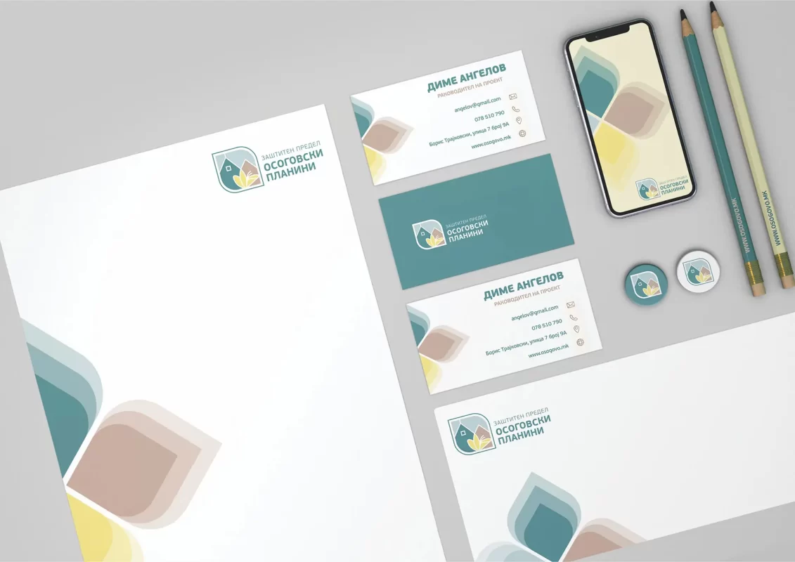 Corporate branding mockup with stationery items, business cards, and smartphone.